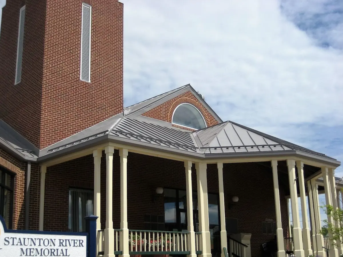 Skilled roofing craftsmen working on a residential roof in Crestview
